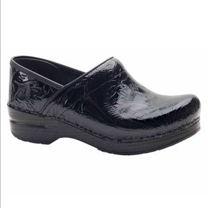 Dankso Floral Embossed Clogs in black